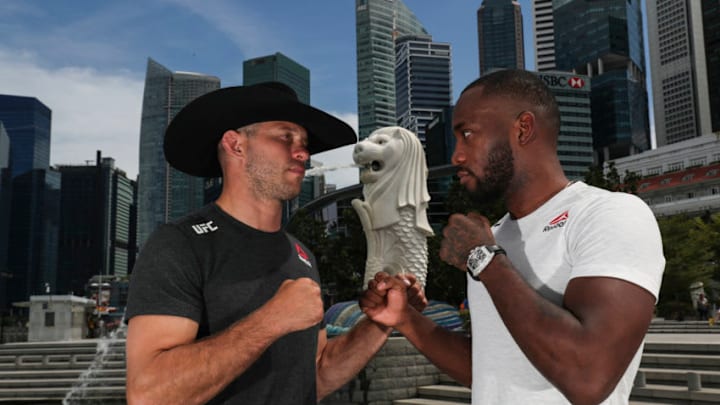 SINGAPORE, SINGAPORE - APRIL 25: Donald Cerrone (L) and Leon Edwards pose for a photo at the Merlion Park, overlooking the financial district, on April 25, 2018 in Singapore. (Photo by Yong Teck Lim/Zuffa LLC)