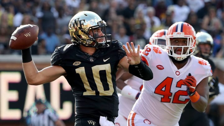 WINSTON SALEM, NC – OCTOBER 06: Christian Wilkins #42 of the Clemson Tigers tries to stop Sam Hartman #10 of the Wake Forest Demon Deacons from throwing a pass during their game at BB&T Field on October 6, 2018 in Winston Salem, North Carolina. (Photo by Streeter Lecka/Getty Images)