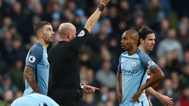 MANCHESTER, ENGLAND – JANUARY 02: Referee Lee Mason shows the red card to Fernandinho of Manchester City after his challenge on Johann Gudmundsson of Burnley during the Premier League match between Manchester City and Burnley at Etihad Stadium on January 2, 2017 in Manchester, England. (Photo by Jan Kruger/Getty Images)