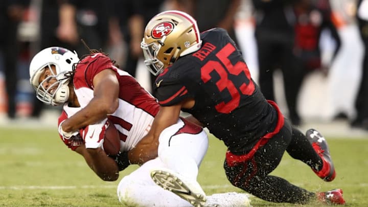 SANTA CLARA, CA - OCTOBER 06: Eric Reid #35 of the San Francisco 49ers tackles Larry Fitzgerald #11 of the Arizona Cardinals after a catch during their NFL game at Levi's Stadium on October 6, 2016 in Santa Clara, California. (Photo by Ezra Shaw/Getty Images)