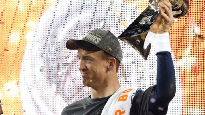 Feb 7, 2016; Santa Clara, CA, USA; Denver Broncos quarterback Peyton Manning (18) celebrates with the Vince Lombardi Trophy after beating the Carolina Panthers in Super Bowl 50 at Levi