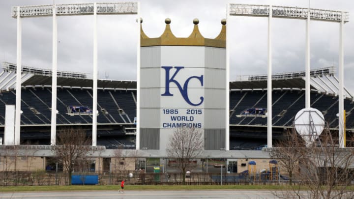 KANSAS CITY, MO - MARCH 19: A jogger runs past an empty Kauffman Stadium, home of the Kansas City Royals, as Major League Baseball has shut down competition due to coronavirus on March 19, 2020 in Kansas City, Missouri. The NBA, NHL, NCAA and MLB have all announced cancellations or postponements of events because of COVID-19. (Photo by Jamie Squire/Getty Images)