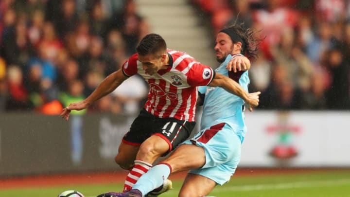 SOUTHAMPTON, ENGLAND – OCTOBER 16: Dusan Tadic of Southampton is challenged by George Boyd of Burnley during the Premier League match between Southampton and Burnley at St Mary’s Stadium on October 16, 2016 in Southampton, England. (Photo by Richard Heathcote/Getty Images)