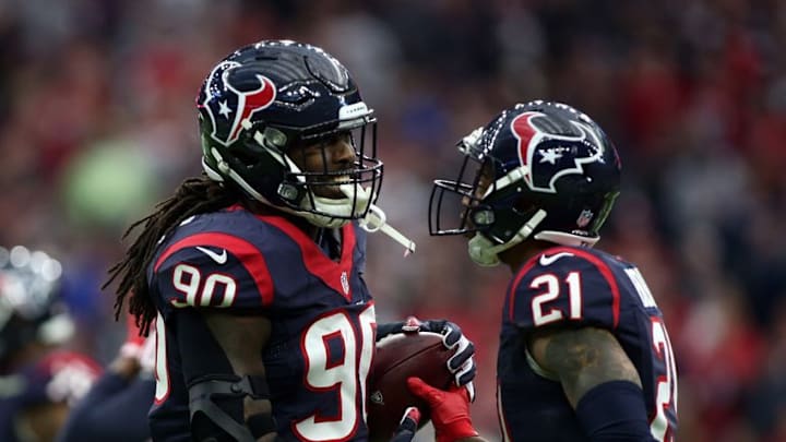 Jan 7, 2017; Houston, TX, USA; Houston Texans defensive end Jadeveon Clowney (90) celebrates with cornerback A.J. Bouye (21) during the first quarter of the AFC Wild Card playoff football game against the Oakland Raiders at NRG Stadium. Mandatory Credit: Troy Taormina-USA TODAY Sports