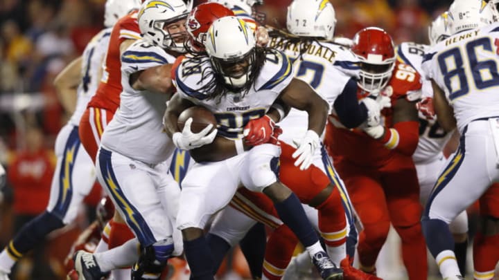 KANSAS CITY, MO - DECEMBER 16: Running back Melvin Gordon #28 of the Los Angeles Chargers rushes the ball through traffic during the first quarter of the against the Kansas City Chiefs at Arrowhead Stadium on December 16, 2017 in Kansas City, Missouri. ( Photo by Jamie Squire/Getty Images )
