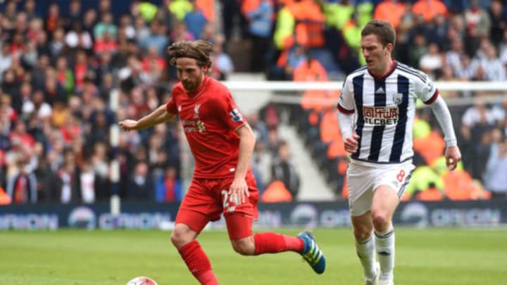 WEST BROMWICH, ENGLAND - MAY 15: Joe Allen of Liverpool and Craig Gardner of West Bromwich Albion compete for the ball during the Barclays Premier League match between West Bromwich Albion and Liverpool at The Hawthorns on May 15, 2016 in West Bromwich, England.