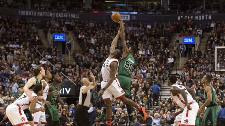 Jan 20, 2016; Toronto, Ontario, CAN; Toronto Raptors center Bismack Biyombo (8) and Boston Celtics forward Amir Johnson (90) jump for a ball during the fourth quarter in a game at Air Canada Centre. The Toronto Raptors won 115-109. Mandatory Credit: Nick Turchiaro-USA TODAY Sports