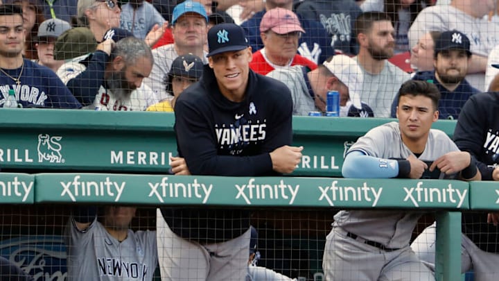 Aaron Judge #99 of the New York Yankees looks on from the dugout with Anthony Volpe #11 during the seventh inning of game one of a doubleheader against the Boston Red Sox at Fenway Park on June 18, 2023 in Boston, Massachusetts. (Photo By Winslow Townson/Getty Images)