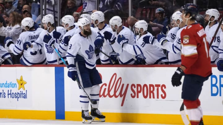 Apr 5, 2022; Sunrise, Florida, USA; Toronto Maple Leafs defenseman Jake Muzzin (8) celebrates his goal against the Florida Panthers with teammates on the bench during the second period at FLA Live Arena. Mandatory Credit: Jasen Vinlove-USA TODAY Sports