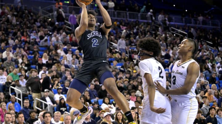 Jan 27, 2023; Los Angeles, CA, USA; Notre Dame Knights forward Zachary White (2) and guard Caleb foster (3) looks on as Sierra Canyon Trailblazers forward Isaiah Elohim (2) shoots a basket in the first half of the Battle of the Valley played at Pauley Pavilion. Mandatory Credit: Jayne Kamin-Oncea-USA TODAY Sports