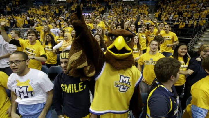 MILWAUKEE, WI - NOVEMBER 08: The Marquette Golden Eagle mascot pumps up the students before the game against the Southern Jaguars at BMO Harris Bradley Center on November 08, 2013 in Madison, Wisconsin. (Photo by Mike McGinnis/Getty Images)