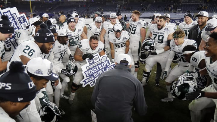 NEW YORK, NY – DECEMBER 27: Head coach Mark Dantonio of the Michigan State Spartans celebrates with his team after defeating the Wake Forest Demon Deacons in the New Era Pinstripe Bowl at Yankee Stadium on December 27, 2019 in the Bronx borough of New York City. Michigan State Spartans won 27-21. (Photo by Adam Hunger/Getty Images)