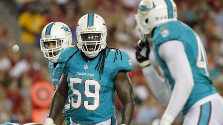 Aug 16, 2014; Tampa, FL, USA; Miami Dolphins middle linebacker Dannell Ellerbe (59) calls a play against the Tampa Bay Buccaneers during the second quarter at Raymond James Stadium. Mandatory Credit: Kim Klement-USA TODAY Sports