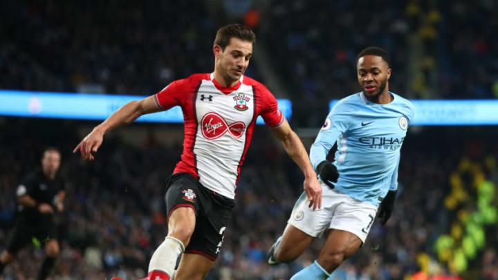 MANCHESTER, ENGLAND - NOVEMBER 29: Cedric Soares of Southampton attempts to get past Raheem Sterling of Manchester City during the Premier League match between Manchester City and Southampton at Etihad Stadium on November 29, 2017 in Manchester, England. (Photo by Clive Brunskill/Getty Images)