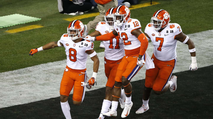 SANTA CLARA, CALIFORNIA – JANUARY 07: A.J. Terrell #8 of the Clemson Tigers celebrates with his teammates after intercepting a ball thrown by Tua Tagovailoa #13 of the Alabama Crimson Tide during the first quarter in the College Football Playoff National Championship at Levi’s Stadium on January 07, 2019 in Santa Clara, California. (Photo by Lachlan Cunningham/Getty Images)