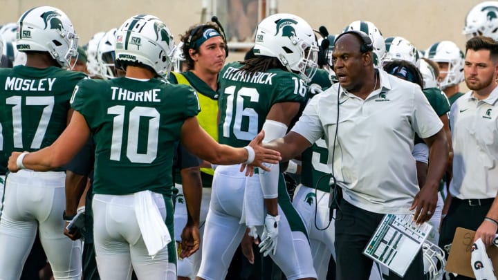 EAST LANSING, MI – SEPTEMBER 02: Michigan State Football Head Coach Mel Tucker greets quarterback Payton Thorne #10 on the sideline during the first half against Western Michigan University at Spartan Stadium on September 2, 2022 in East Lansing, Michigan. (Photo by Jaime Crawford/Getty Images)