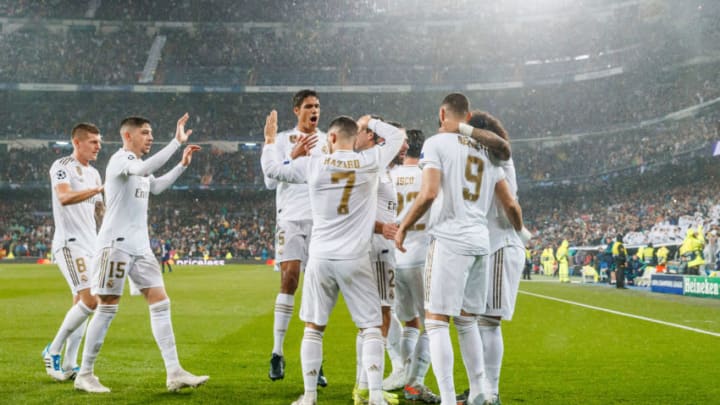MADRID, SPAIN - NOVEMBER 26: Karim Benzema of Real Madrid celebrates his goal with team mates during the UEFA Champions League group A match between Real Madrid and Paris Saint-Germain at Bernabeu on November 26, 2019 in Madrid, Spain. (Photo by TF-Images/Getty Images)
