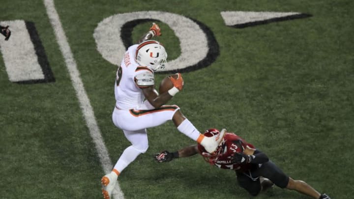 LOUISVILLE, KENTUCKY - SEPTEMBER 19: Brevin Jordan #9 of the Miami Hurricanes runs the ball against the Louisville Cardinals at Cardinal Stadium on September 19, 2020 in Louisville, Kentucky. (Photo by Andy Lyons/Getty Images)