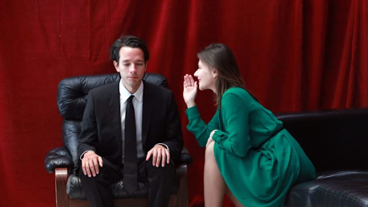 LONDON, ENGLAND - OCTOBER 04: Twin Peaks fans dressed as the characters of Special Agent Dale Cooper and Laura Palmer sit in the Red Room during the sixth annual Twin Peaks UK Festival at Genesis Cinema on October 4, 2015 in London, England. Created by writer Mark Frost and director David Lynch, the American television serial drama Twin Peaks first aired in the United Kingdom 25 years ago this month. The inaugural Twin Peaks UK Festival was in 2010 with this year's festival eagerly celebrating a forthcoming limited series continuation to air on Showtime in 2016, twenty-five years after the series ended its two season run in the 1990s. (Photo by Amy T. Zielinski/Getty Images)