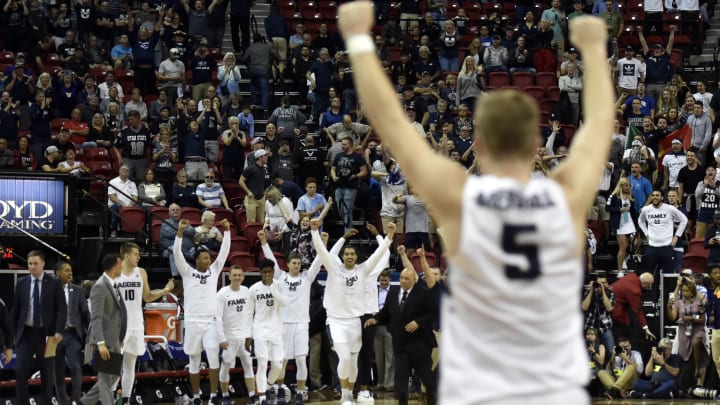 LAS VEGAS, NEVADA – MARCH 16: The Utah State Aggies celebrate their victory over the San Diego State Aztecs in the championship game of the Mountain West Conference basketball tournament at the Thomas & Mack Center on March 16, 2019 in Las Vegas, Nevada. Utah State won 64-57. (Photo by David Becker/Getty Images)