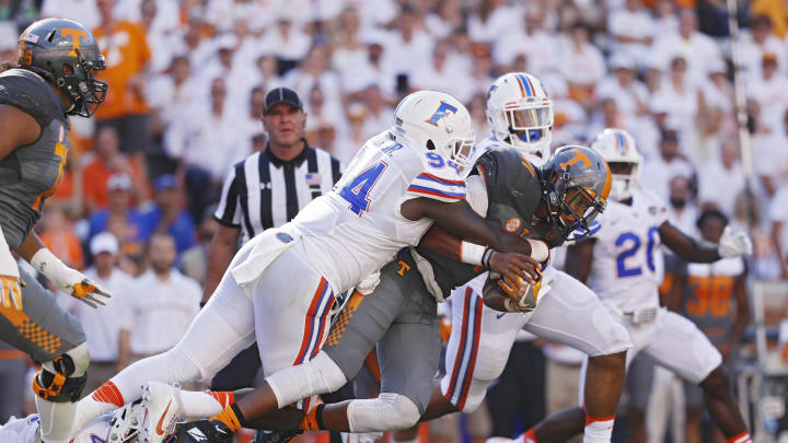 KNOXVILLE, TN – SEPTEMBER 24: Bryan Cox Jr. #94 of the Florida Gators tackles Joshua Dobbs #11 of the Tennessee Volunteers in the second quarter at Neyland Stadium on September 24, 2016 in Knoxville, Tennessee. (Photo by Joe Robbins/Getty Images)