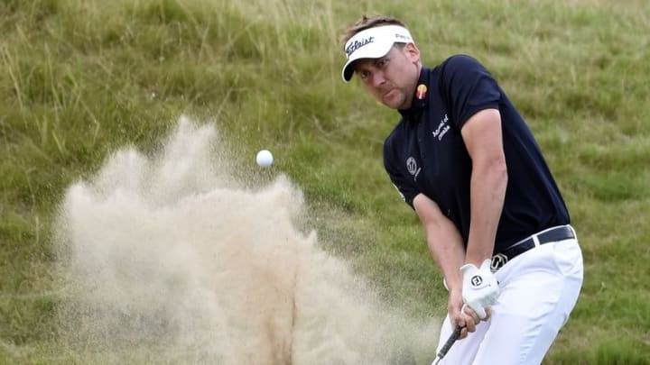Aug 13, 2015; Sheboygan, WI, USA; Ian Poulter plays from a bunker on the 18th hole during the first round of the 2015 PGA Championship golf tournament at Whistling Straits. Mandatory Credit: Michael Madrid-USA TODAY Sports