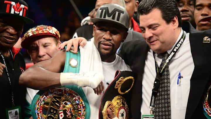 Sep 12, 2015; Las Vegas, NV, USA; Floyd Mayweather celebrates after defeating Andre Berto (not pictured) in their WBA/WBC welterweight title bout at MGM Grand Garden Arena. Mayweather won via unanimous decision. Mandatory Credit: Joe Camporeale-USA TODAY Sports