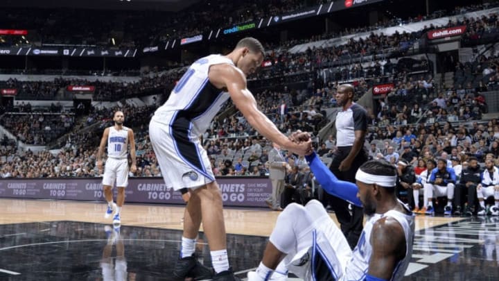 SAN ANTONIO, TX - NOVEMBER 4: Aaron Gordon #00 helps up Terrence Ross #31 of the Orlando Magic during the game against the San Antonio Spurs on November 4, 2018 at the AT&T Center in San Antonio, Texas. NOTE TO USER: User expressly acknowledges and agrees that, by downloading and/or using this photograph, user is consenting to the terms and conditions of the Getty Images License Agreement. Mandatory Copyright Notice: Copyright 2018 NBAE (Photos by Mark Sobhani/NBAE via Getty Images)