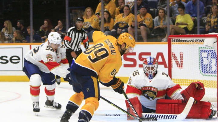 NASHVILLE, TN - SEPTEMBER 16: Nashville Predators center Frederick Gaudreau (89) corrals the loose puck in front of Panthers goalie Ryan Bednard (35) as defenseman MacKenzie Weegar (52) defends during the second NHL preseason game between the Nashville Predators and Florida Panthers, held on September 16, 2019, at Bridgestone Arena in Nashville, Tennessee. (Photo by Danny Murphy/Icon Sportswire via Getty Images)