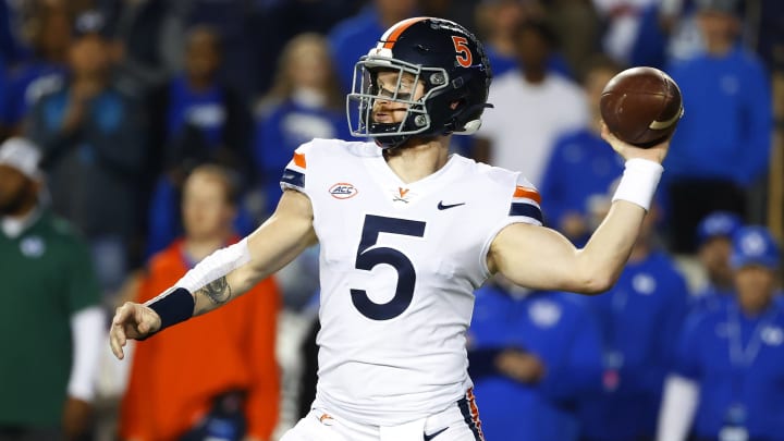 Oct 30, 2021; Provo, Utah, USA; Virginia Cavaliers quarterback Brennan Armstrong (5) looks to pass against the Brigham Young Cougars at LaVell Edwards Stadium. Mandatory Credit: Jeffrey Swinger-USA TODAY Sports