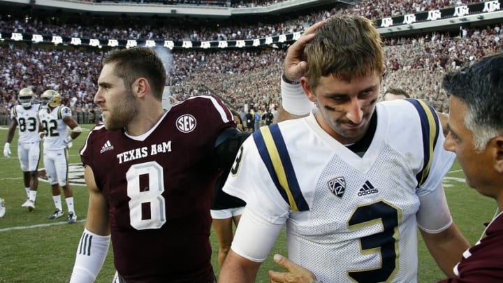 Sep 3, 2016; College Station, TX, USA; Texas A&M quarterback Trevor Knight (8) pats UCLA Bruins quarterback Josh Rosen (3) on the head after the Aggies 31-24 overtime victory. Mandatory Credit: Ray Carlin-USA TODAY Sports