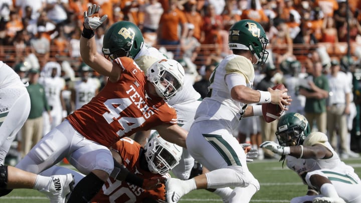 AUSTIN, TX – OCTOBER 13: Breckyn Hager #44 of the Texas Longhorns and Charles Omenihu #90 apply pressure to Charlie Brewer #12 of the Baylor Bears in the first half at Darrell K Royal-Texas Memorial Stadium on October 13, 2018 in Austin, Texas. (Photo by Tim Warner/Getty Images)