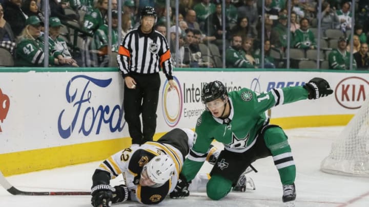 DALLAS, TX - NOVEMBER 16: Boston Bruins right wing David Backes (42) and Dallas Stars center Mattias Janmark (13) battle for the puck behind the net during the game between the Dallas Stars and the Boston Bruins on November 16, 2018 at the American Airlines Center in Dallas, Texas. (Photo by Matthew Pearce/Icon Sportswire via Getty Images)