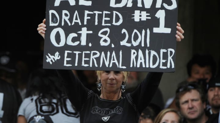 OAKLAND, CA - OCTOBER 16: An Oakland Raiders fan hold up a sign in honor of the late owner Al Davis before the game against the Cleveland Browns at O.co Coliseum on October 16, 2011 in Oakland, California. (Photo by Thearon W. Henderson/Getty Images)