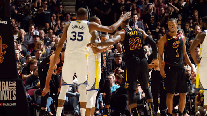 CLEVELAND, OH - JUNE 8: LeBron James #23 of the Cleveland Cavaliers and Kevin Durant #35 of the Golden State Warriors shake hands during Game Four of the 2018 NBA Finals on June 8, 2018 at Quicken Loans Arena in Cleveland, Ohio. NOTE TO USER: User expressly acknowledges and agrees that, by downloading and or using this Photograph, user is consenting to the terms and conditions of the Getty Images License Agreement. Mandatory Copyright Notice: Copyright 2018 NBAE (Photo by Andrew D. Bernstein/NBAE via Getty Images)