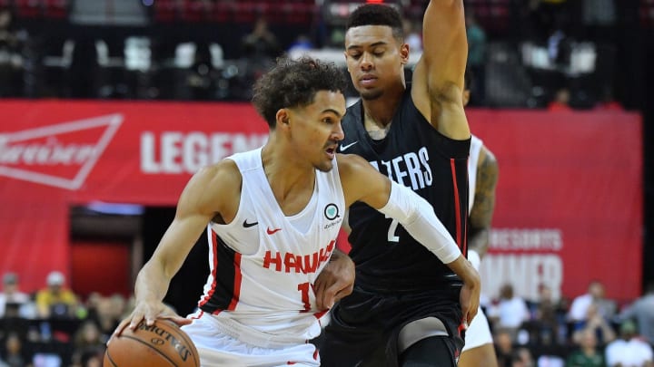 LAS VEGAS, NV – JULY 08: Trae Young #11 of the Atlanta Hawks drives against Wade Baldwin IV #2 of the Portland Trail Blazers during the 2018 NBA Summer League at the Thomas & Mack Center on July 8, 2018 in Las Vegas, Nevada. NOTE TO USER: User expressly acknowledges and agrees that, by downloading and or using this photograph, User is consenting to the terms and conditions of the Getty Images License Agreement. (Photo by Sam Wasson/Getty Images)