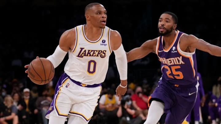 Oct 10, 2021; Los Angeles, California, USA; Los Angeles Lakers guard Russell Westbrook (0) dribbles the ball past Phoenix Suns forward Mikal Bridges (25) during the first quarter at Staples Center. Mandatory Credit: Robert Hanashiro-USA TODAY Sports Oct 10, 2021; Los Angeles, California, USA; Los Angeles Lakers guard Russell Westbrook (0) dribbles the ball past Phoenix Suns forward Mikal Bridges (25) during the first quarter at Staples Center. Mandatory Credit: Robert Hanashiro-USA TODAY Sports