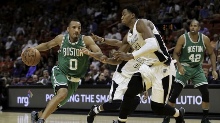 MIAMI, FL - DECEMBER 18: Avery Bradley #0 of the Boston Celtics in action against Hassan Whiteside #21 of the Miami Heat during the game at the American Airlines Arena on December 18, 2016 in Miami, Florida. NOTE TO USER: User expressly acknowledges and agrees that, by downloading and or using this photograph, User is consenting to the terms and conditions of the Getty Images License Agreement.Ê(Photo by Rob Foldy/Getty Images)