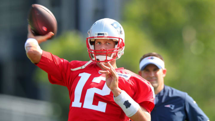 FOXBOROUGH, MA – JULY 27: Josh McDaniels keeps an eye on New England Patriots quarterback Tom Brady as he throws a pass during Patriots training camp at the Gillette Stadium practice facility in Foxborough, MA on July 27, 2018. (Photo by John Tlumacki/The Boston Globe via Getty Images)