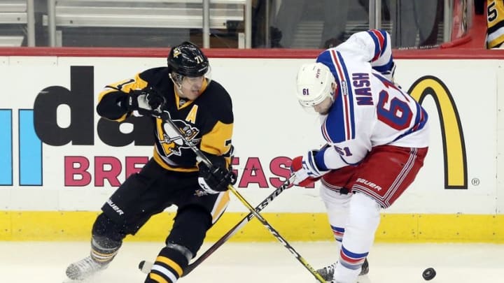 Apr 16, 2016; Pittsburgh, PA, USA; Pittsburgh Penguins center Evgeni Malkin (71) and New York Rangers left wing Rick Nash (61) battle for the puck during the second period in game two of the first round of the 2016 Stanley Cup Playoffs at the CONSOL Energy Center. Mandatory Credit: Charles LeClaire-USA TODAY Sports