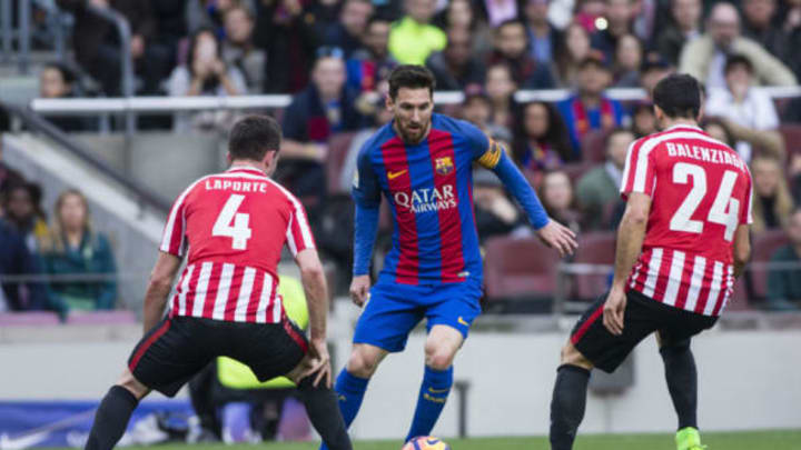 Lionel Messi of FC Barcelona defended by Laporte of Athletic Club and Balenziaga of Athletic Club during the La Liga match between FC Barcelona vs Athletic Club at Camp Nou Stadium on February 04, 2017 in Barcelona, Spain. (Photo by Xavier Bonilla/NurPhoto via Getty Images)