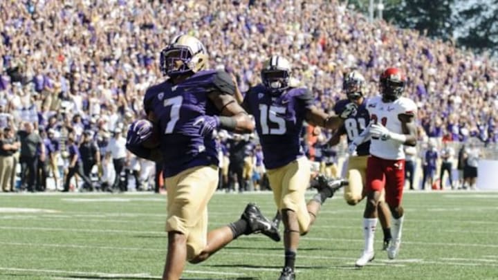 Sep 6, 2014; Seattle, WA, USA; Washington Huskies linebacker Shaq Thompson (7) scores a 57 yard touchdown on offense against the Eastern Washington Eagles during the first half at Husky Stadium. Mandatory Credit: Steven Bisig-USA TODAY Sports