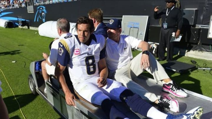 Oct 20, 2013; Charlotte, NC, USA; St. Louis Rams quarterback Sam Bradford (8) is taken off the field on a cart in the fourth quarter. The Carolina Panthers defeated the St. Louis Rams 30-15 at Bank of America Stadium. Mandatory Credit: Bob Donnan-USA TODAY Sports