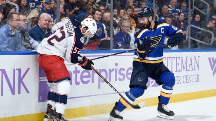 ST. LOUIS, MO - NOVEMBER 1: Emil Bemstrom #52 of the Columbus Blue Jackets and Alex Pietrangelo #27 of the St. Louis Blues battle for the puck at Enterprise Center on November 1, 2019 in St. Louis, Missouri. (Photo by Joe Puetz/NHLI via Getty Images)
