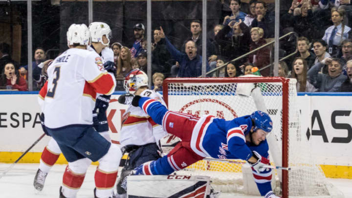 NEW YORK, NY - NOVEMBER 10: New York Rangers Left Wing Brendan Lemieux (48) trips over Florida Panthers Goalie Samuel Montembeault (33) during an Eastern Conference match-up between the Florida Panthers and the New York Rangers on November 10, 2019, at Madison Square Garden in New York, NY. (Photo by David Hahn/Icon Sportswire via Getty Images)