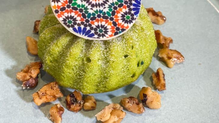Pistachio Cake with cinnamon pastry cream and candied walnuts