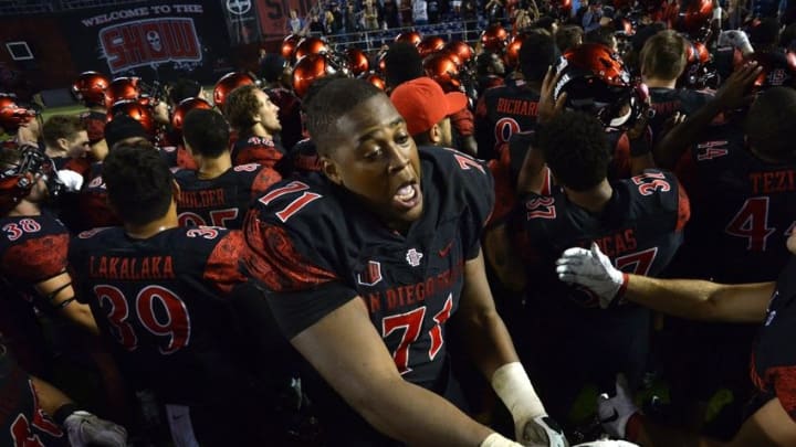 Oct 23, 2015; San Diego, CA, USA; San Diego State Aztecs offensive lineman Pearce Slater (71) celebrates with teammates after defeating the Utah State Aggies 48-14 at Qualcomm Stadium. Mandatory Credit: Jake Roth-USA TODAY Sports