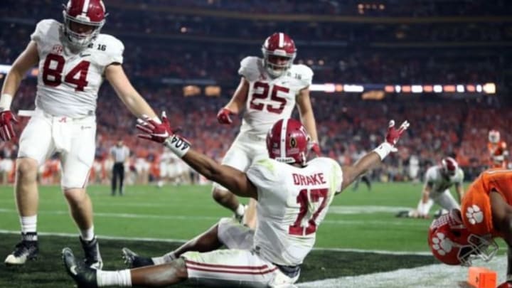 Jan 11, 2016; Glendale, AZ, USA; Alabama Crimson Tide running back Kenyan Drake (17) celebrates after returning a kick off for a touchdown against the Clemson Tigers in the fourth quarter in the 2016 CFP National Championship at University of Phoenix Stadium. Mandatory Credit: Mark J. Rebilas-USA TODAY Sports