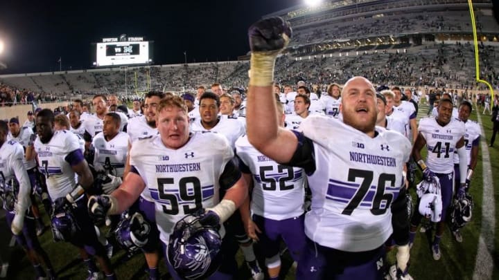 Oct 15, 2016; East Lansing, MI, USA; Northwestern Wildcats celebrates a win over Michigan State Spartans after a game at Spartan Stadium. Mandatory Credit: Mike Carter-USA TODAY Sports