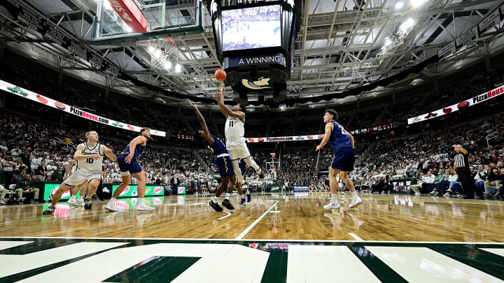 Nov 7, 2022; East Lansing, Michigan, USA; Michigan State Spartans guard A.J. Hoggard (11) drives to the basket against the Northern Arizona Lumberjacks in the second half at Jack Breslin Student Events Center. Mandatory Credit: Dale Young-USA TODAY Sports